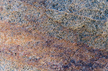Granite background. The wall of the old building. Close-up.