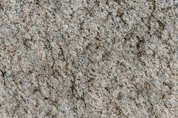 Granite background. The wall of the old building. Close-up.