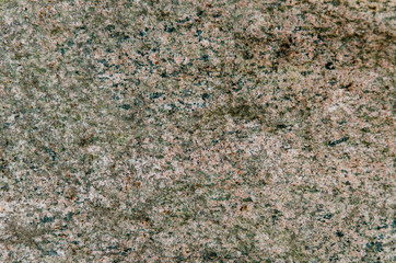 Granite background. The wall of the old building. Close-up.