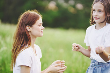 mother and daughter having fun in the park