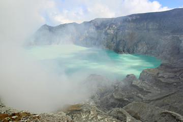 Banyuwangi, East Java, Indonesia, May 27, 2015. A turquoise sulfur lake that is part of the Ijen crater area which has a caldera wall as high as 300 to 500 meters. 