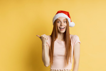 Beautiful caucasian female model wearing santa hat