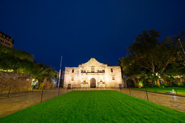 The Alamo Mission at night in downtown San Antonio, Texas, USA. The Mission is a part of the San...