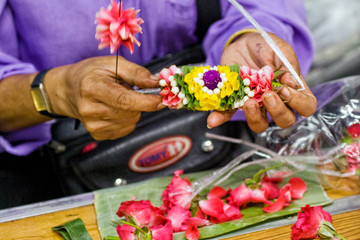 Phuang malai are a Thai form of floral garland. They are often given as offerings. Assembled here...