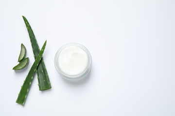 Open jar of cream and aloe isolated on white, top view. Organic cosmetics