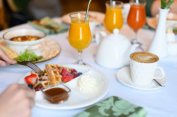 morning Breakfast or brunch in the restaurant. table with drinks and food. selective focus