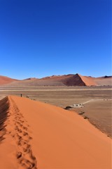 Fototapeta na wymiar Climbing up the dune 45 (big daddy) in Namibia, Africa