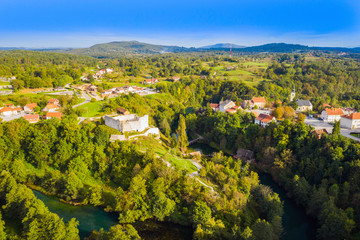 Fototapeta na wymiar Croatia, beautiful green countryside landscape, fortress and town of Slunj