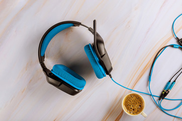 Gaming over ear headset with microphone on cup of coffee