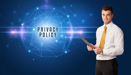 Businessman thinking about security solutions with PRIVACY POLICY inscription
