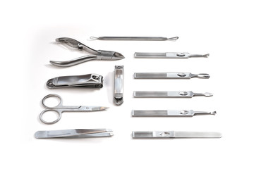 Metallic manicure set with black case on an isolated white background. Beauty salon and tools for nails. Women's handbag gift