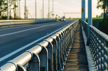 The car is not in focus on the overpass. hitchhiking tourism