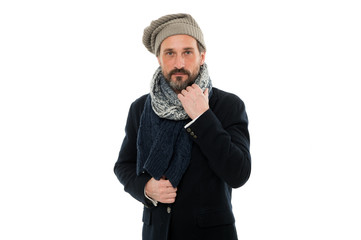 mature man feeling cold in winter. chill outside. winter weather forecast. man wear warm clothes. bearded man in knitted hat and scarf. winter fashion accessory. male isolated on white