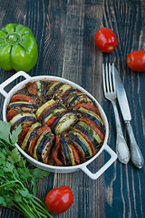 Ratatouille is a traditional French vegetable dish cooked in the oven. Diet vegetarian dish. Balanced nutrition. Eco food. Space for text.