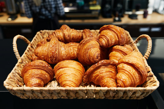 puff croissants folded in a wicker basket, pastry bakery, fresh buns
