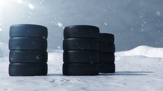 3d illustration Winter tires on a with falling snow background of snow storm, snowfall and slippery winter road. Winter tires concept. Concept tyres, winter tread. Wheel replacement. Road safety.