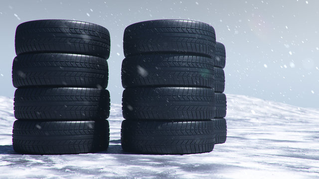 Winter tires on a background of snowstorm, snowfall and slippery winter road. Winter tires concept. Concept tyres, winter tread. Wheel replacement. Road safety. 3d illustration with falling snow