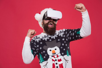 imagine best xmas party. bearded hipster in vr glasses. man play game. winter indoor vs outdoor activity. Virtual reality. Santa virtual goggles. Happy New Year 2020 celebration holiday concept