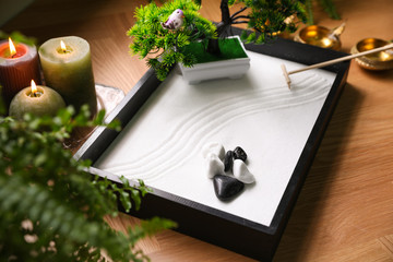Naklejka na ściany i meble Beautiful miniature zen garden and candles on table
