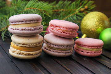 Tasty macarons on wooden background