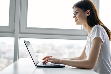 woman working on laptop at home