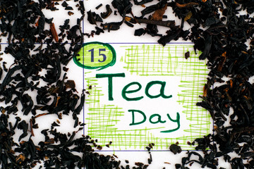 Reminder Tea Day in calendar with spilling dried tea leaves.