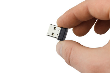 small flash drive in hand close up. Isolate	