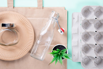 Sustainable eco friendly concept. Kitchenware on a teal background.