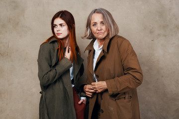 two women standing in front of building