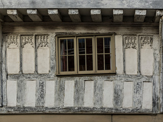 Fototapeta na wymiar Window in a Black and white house by Tewkesbury Abbey Gloucestershire England