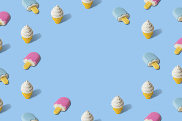 Creative art made of ice cream pattern on blue.