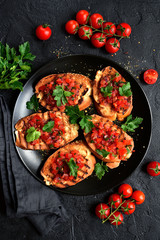 Grilled toasts with tomato salsa. Top view with copy space.