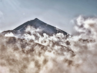 Mystical atmosphere by  rising fog spirit at the foot of the volcano El Teide