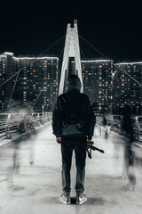 a man stands on the bridge