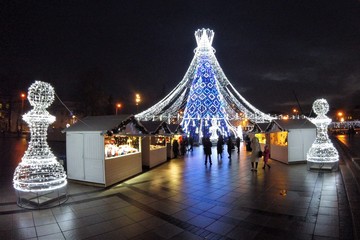 Beautiful Christmas tree decorated with white and blue lights for Christmas 2019 and New Year 2020,...