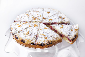 cherry pie with cut piece for serving isolate on white background