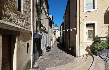 The typical alley in an old town in the South of France.