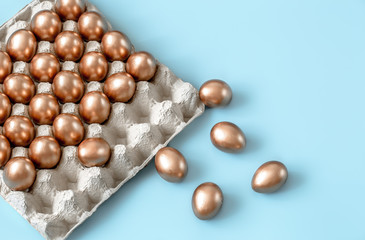Background with Easter eggs in gold color.