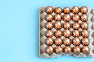 Background with Easter eggs in gold color.