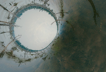 Lake with old trees sticking out of the water. 360 VR panorama drone shot. Cambodia near ancient Angkor Wat Temple Ruin Complex sunrise drone 4k