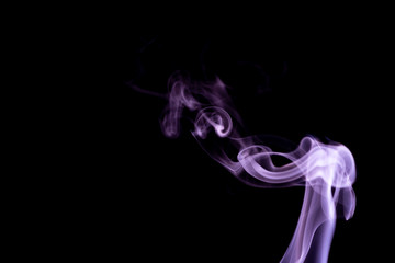 Fototapeta premium Purple wavy smoke abstract on a black background