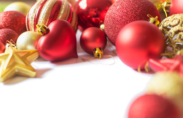 Bunch of red and golden christmas baubles isolated on white background