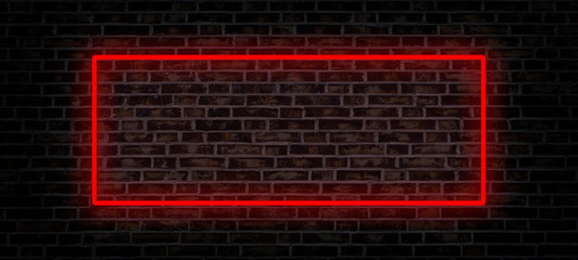 Red neon lamp sign on brick wall