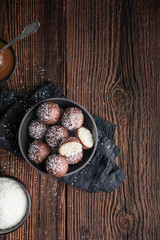 No bake delicious candy, sweet coconut balls dipped in chocolate with copy space