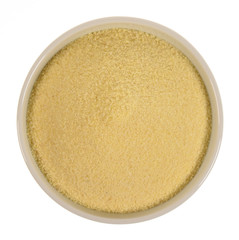 Semolina in a bowl isolated on white