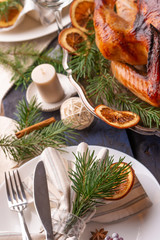 Christmas table, festive baked turkey, and served table. Vertical frame