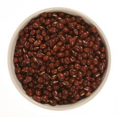 Red adzuki beans in a bowl isolated on white background