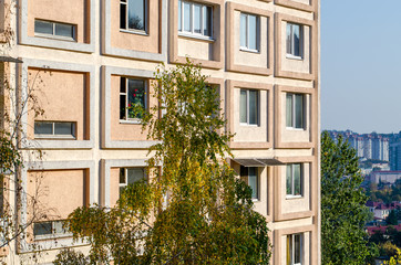 Fototapeta na wymiar Light beige facade of a residential building
