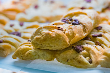 Assortment of delicious freshly baked sweet and puff pastry for sale on counter of shop, grocery, market, cafe or bakery. Dessert, food and traditional french cuisine concept