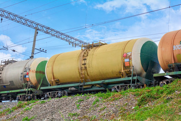 Fototapeta na wymiar Set of tanks with oil and fuel transport by rail. Railroad Cargo train